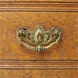 Maple & Co. - Arts & Crafts oak dresser with stained glass cupboard, raised section with pierced pediment above a mirrored back, with a stained glass fronted cupboard with fixed shelf, single long drawer, above a pair of fielded panels, with open recess above a short drawer, raised above a full length undertier with turned supports