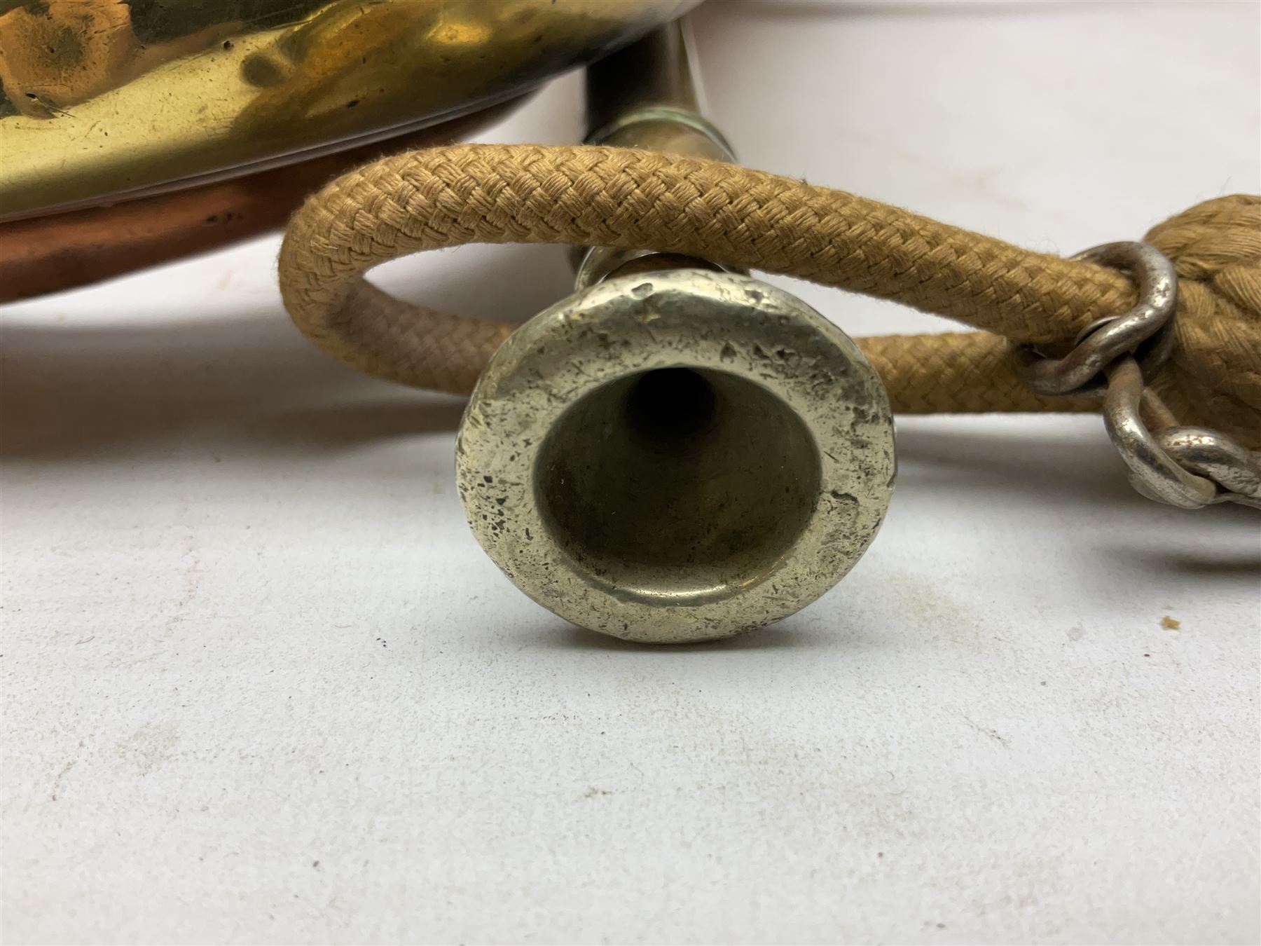 WW2 copper and brass bugle inscribed George Potter & Co, Aldershot 1939 L28cm; two cane and one leather covered swagger sticks; and three small pairs of plain brass shell cases (10)