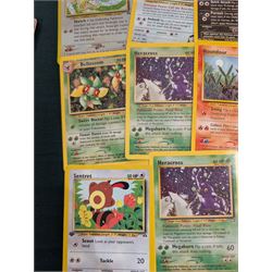 Collection of Pokemon TGC trading cards, including two WB First Movie Black Star promo cards Pikachu no. 4 and Dragonite no. 5, two Ancient Mew Black Star holo promo cards, Gym Challenge Giovanni's Persian 8/132 holo and a small collection WOTC, Neo Discovery and Neo Genesis cards, together with thirty four Bandai Carddass Pokemon cards, including prism Charizard no. 186 and Pokemon Topps cards including holo examples 