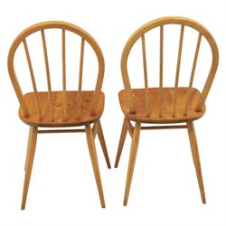 Ercol - set of four 'Windsor' waxed elm chairs, with hoop back design, on tapering supports