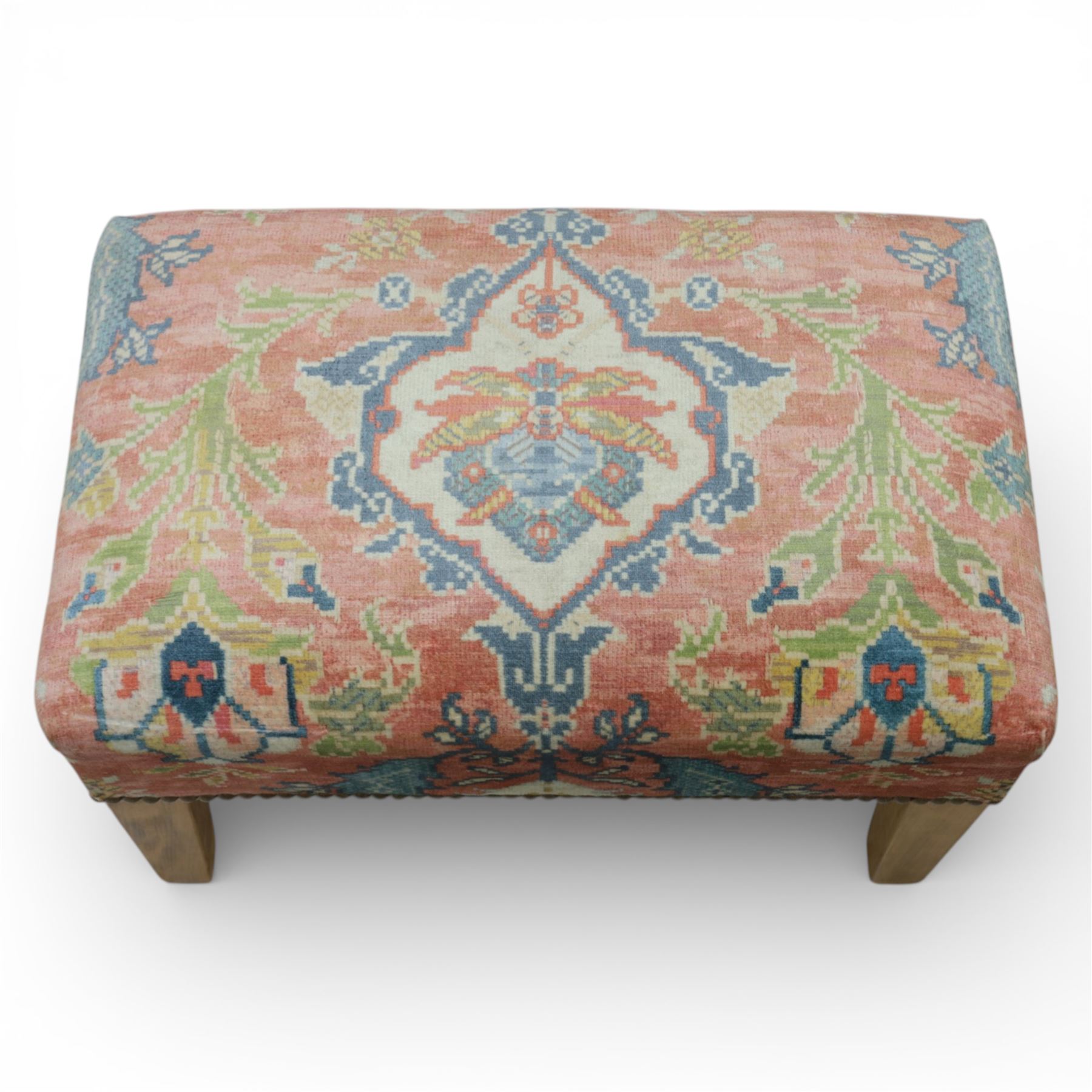 Pair of needlepoint footstools, retailed by The Bespoke Footstool Co, brass studded trim on tapered oak supports