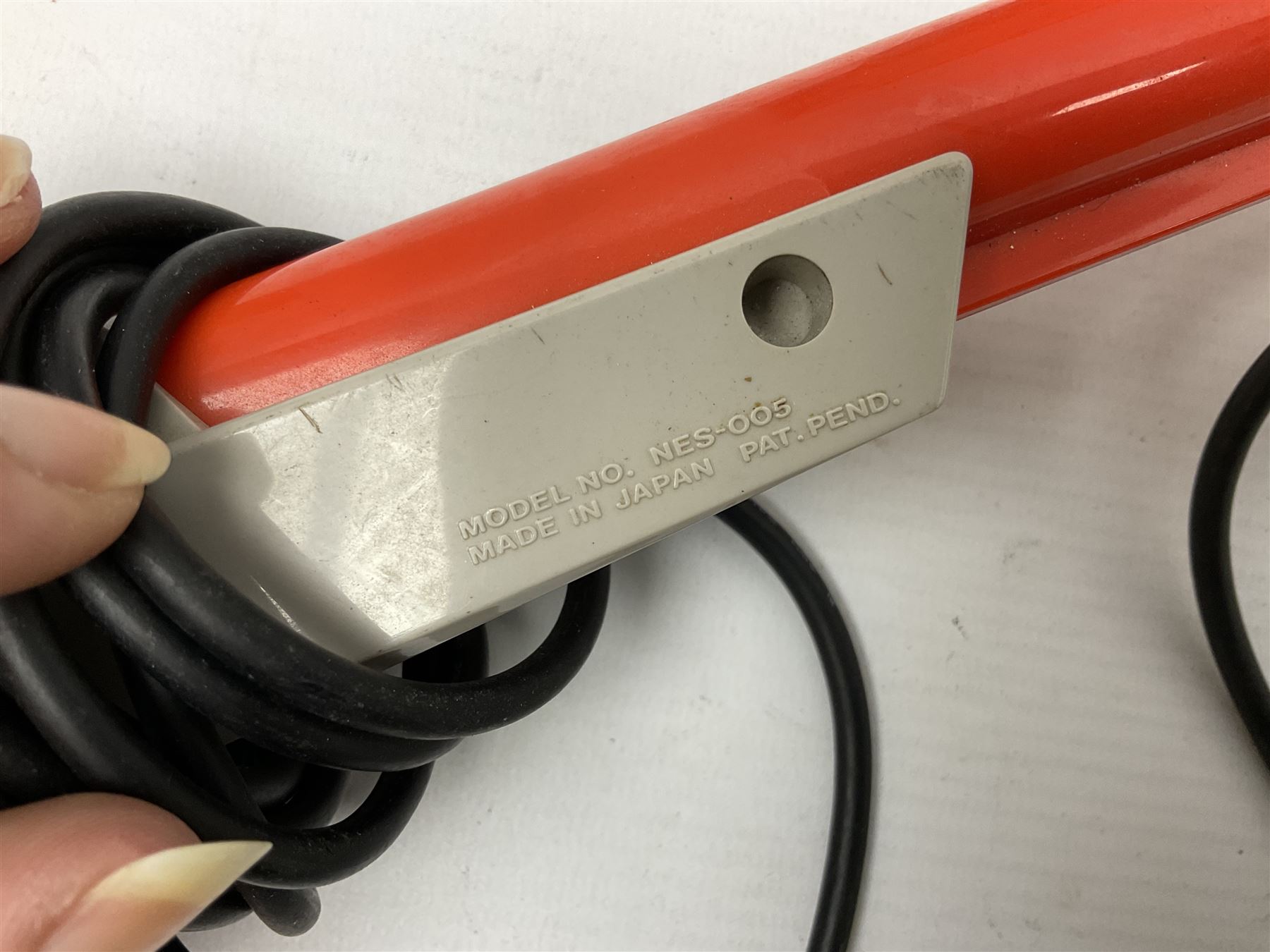 Nintendo Entertainment System (1985) console with two controllers, accessories and instruction booklet. NES Games ‘Duck Hunt’ with Nintendo Zapper gun, ‘Pinball’ and ‘Super Mario Bros.’, all with original sleeves and instruction booklets. NES game ‘Super Mario Bros. 2’ cartridge only