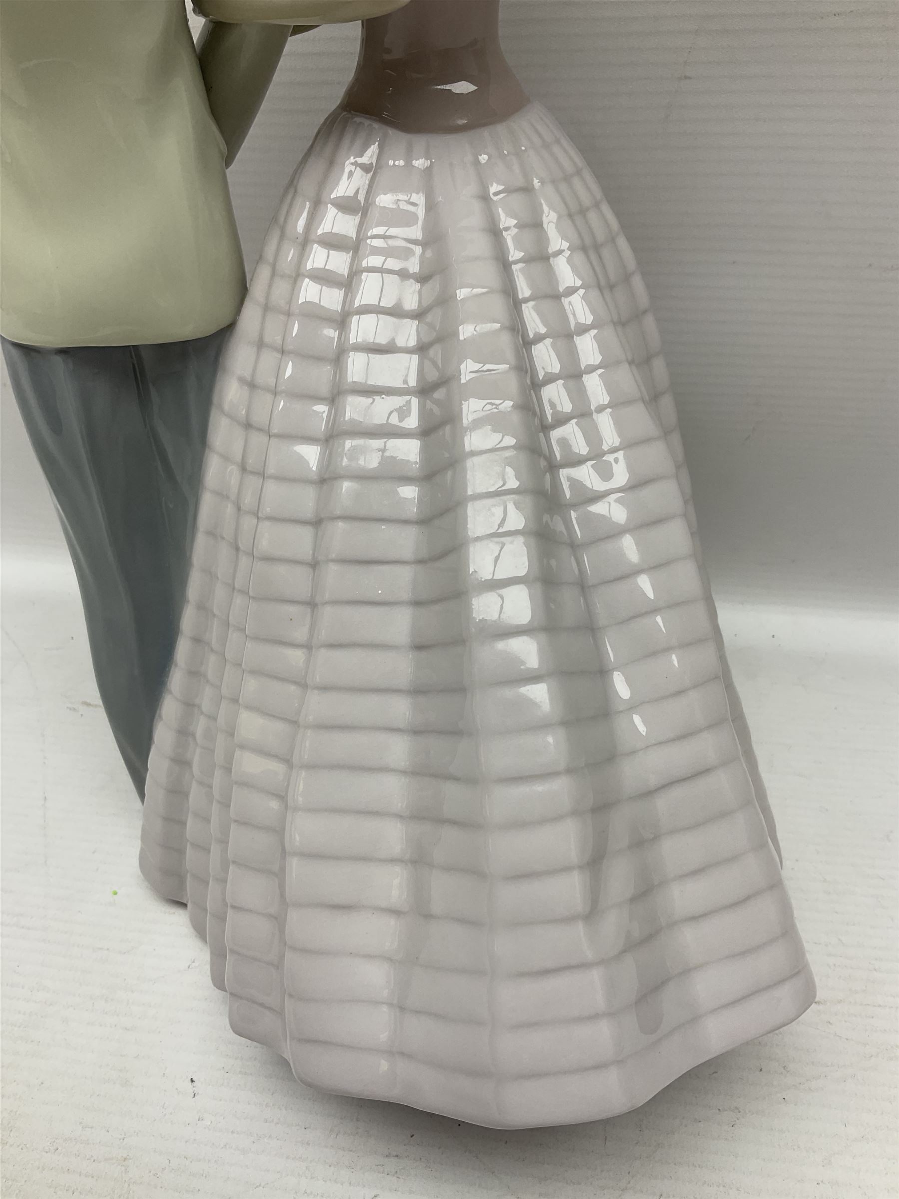 Lladro figure, An Evening Out, modelled as a man and women in evening dress, no 5540, year issued 1988, year retired 1991, H32cm