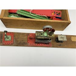 Mamod small stationary steam plant with circular saw bench and grinder mounted on long wooden board L107cm; and quantity of predominantly red/green Meccano in wooden box with die-cast models etc