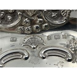 Edwardian silver swing handled basket, of navette form, with four repousse lion masks to each corner and with pierced and embossed floral, scroll and shell decoration to sides, base and handle, hallmarked Charles Horner, Birmingham 1906, height including handle H20cm