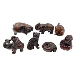 Seven carved netsukes, to include pig, elephant, dragons, rat etc 