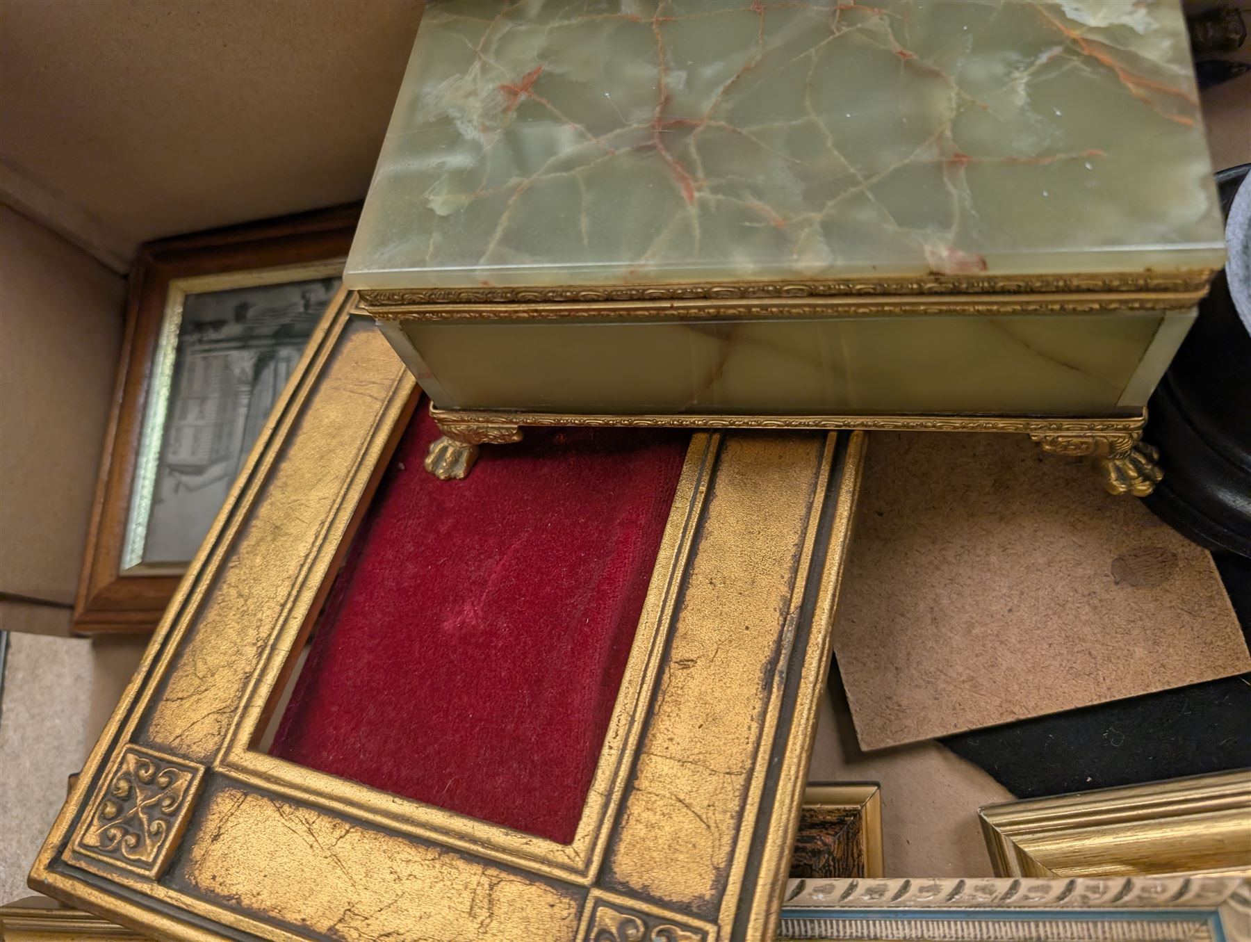 Brass easels, onyx box, frames, costume jewellery, pen nibs, etc, in two boxes
