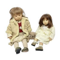 Two Zapf Creation limited edition designer collection dolls, by Brigette Paetsch, the first example with faux suede jacket, red jumper and denim skirt, no. 460, the second example 'Linda' in white dress with teddy bear accessory, no. 785, each signed B Paetsch, tallest L60cm