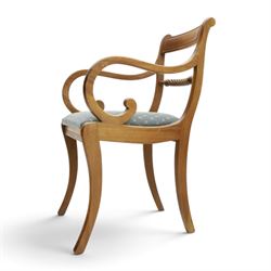 19th century mahogany extending dining table, rectangular top with rounded corners raised on turned and fluted supports with brass cups and castors, with two additional leaves; with set of eight (6+2) Regency design mahogany dining chairs, spiral-reeded back-bar over drop-in seats and sabre supports (W54cm H85cm)