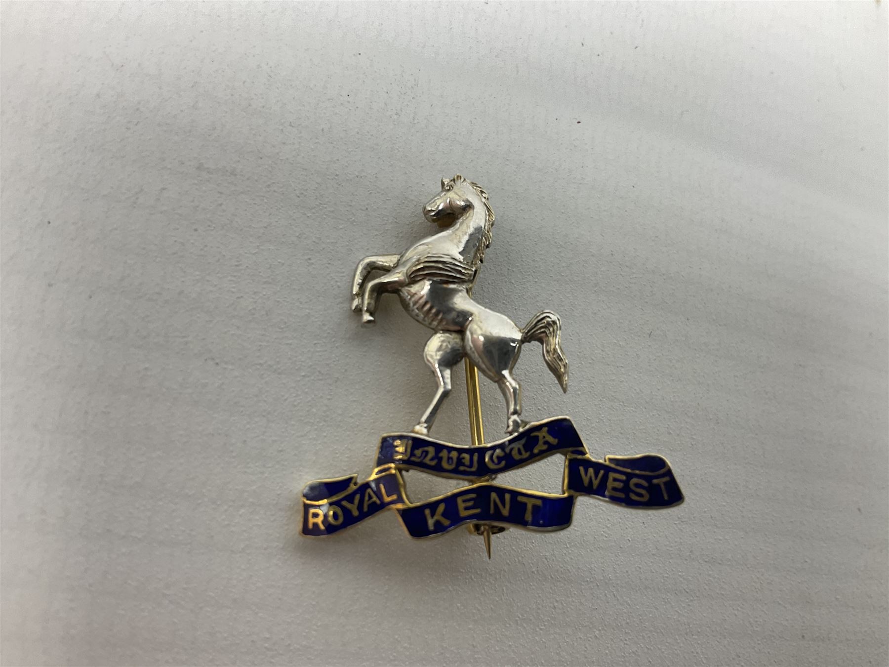 Royal West Kent regiment 9ct gold and enamel sweetheart brooch; The Queens Own regiment silver and enamel sweetheart brooch; and another sweetheart brooch for the Royal West Kent regiment (3)