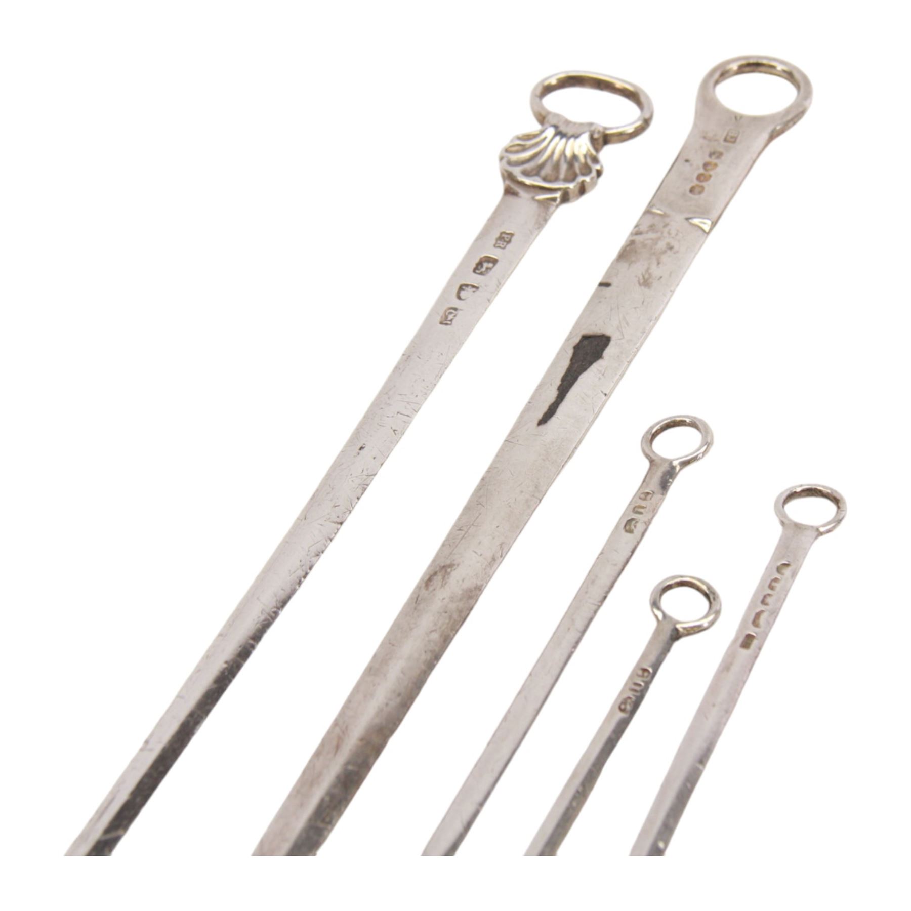 Two George III silver meat skewers, the first example with shell mounted ring terminal, hallmarked Philip Roker III, London 1765, L31cm, the second with ring terminal, hallmarked Thomas Wilkes Barker, London 1810, L32.5cm, together with three George III silver poultry skewers, one example hallmarked Solomon Hougham, London, date letter worn, possibly 1804/1806, and two hallmarked London 1804, no visible makers marks, longest poultry skewer L20cm, smallest L15.5cm, bearing Christie's lot label, (5)

Provenance: Lot 225, portrait Miniatures, Objects of Vertu and Silver, Christie's, 22nd February 2005