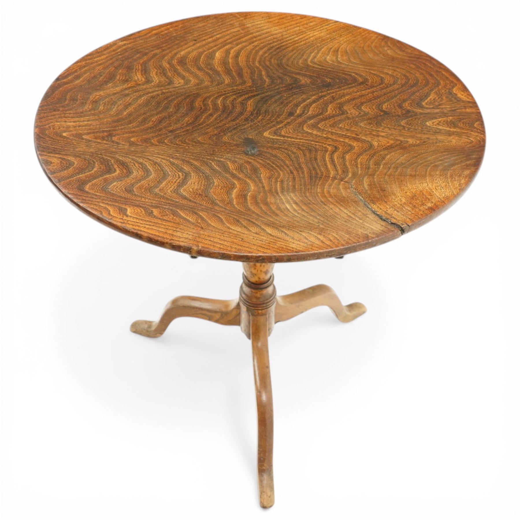 George III figured elm wine table with oval flip-top, raised on turned vasiform pedestal with tripod base