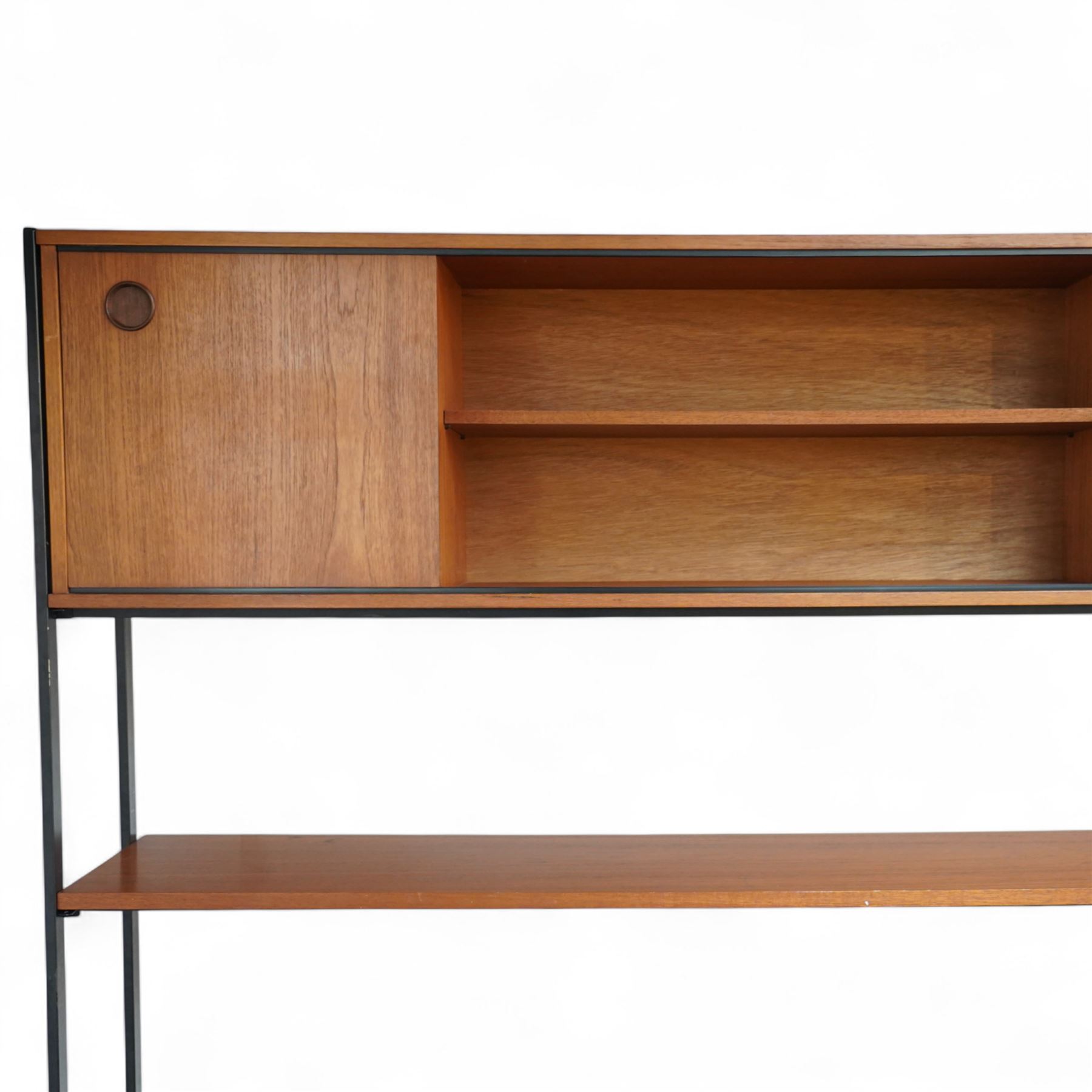 Avalon - modular teak wall unit, with black metal supports, fitted with cupboards, drawers, and adjustable shelves, corner configuration