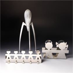 Collection of Alessi items, comprising a 'Juicy Salif' lemon squeezer designed by Philippe Starck, a condiment set designed by Ettore Sottsass, two 'Carlo - a ghost on top of a bottle' designed by Mattia Di Rosa, and further items, all stamped (10)