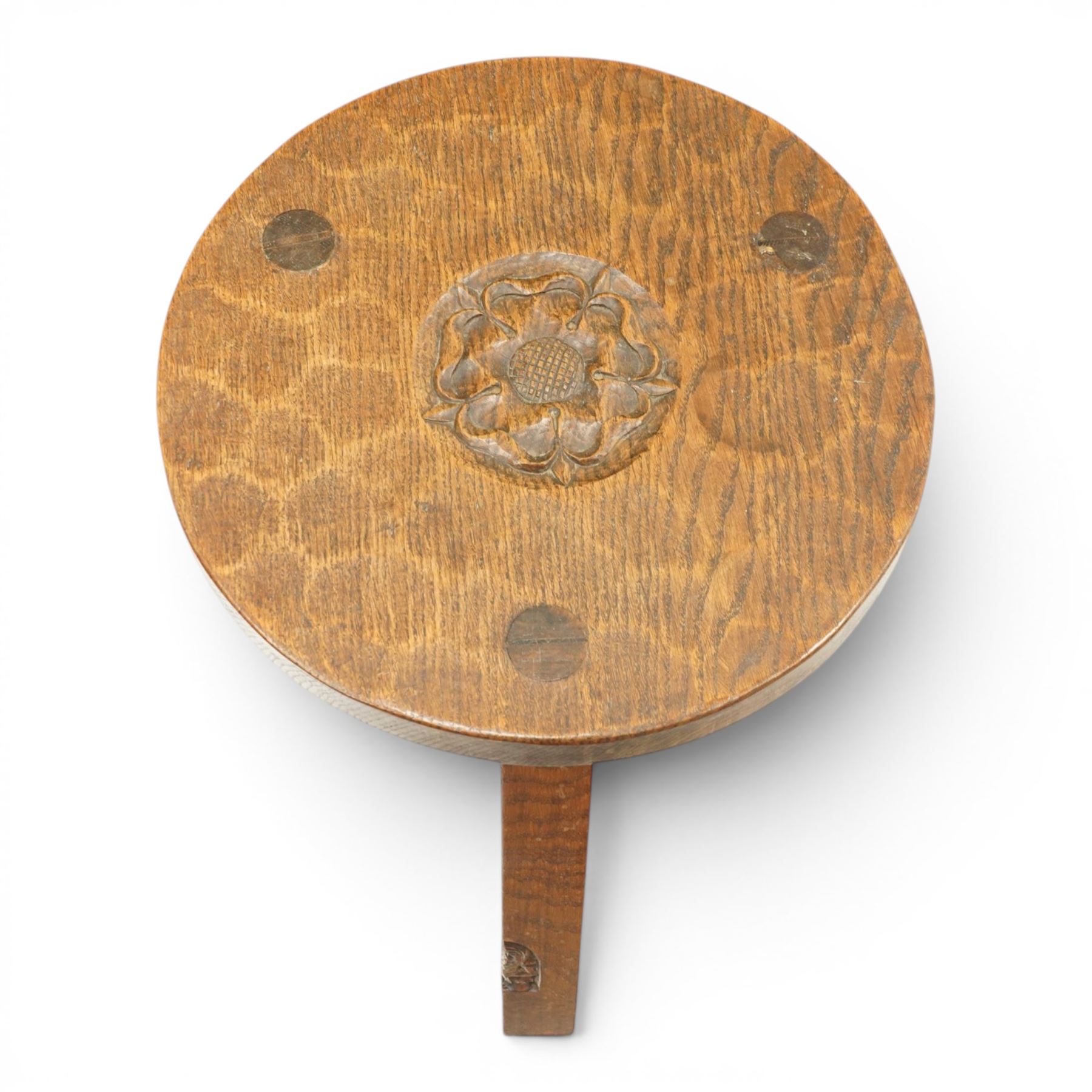 Gnomeman - circular adzed oak stool with carved Yorkshire Rose top, raised on three shaped supports carved with gnome signature, by Thomas Whittaker, Littlebeck, Whitby