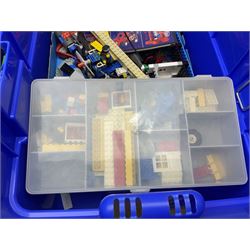 Lego - large quantity of part-built models and loose component parts including Lego Technic and Lego System, space and road vehicles, ships and boats, helicopter etc; together with two set boxes and folder  containing large quantity of instruction booklets; stored in two very large plastic boxes