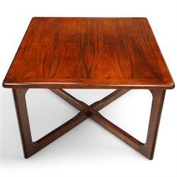 Dyrlund - contemporary Santos rosewood coffee table, floating design, square top of elegant design with clean lines and chamfered square legs 

Note: Dyrlund is a Danish furniture manufacturer known for its high-quality, handcrafted pieces, particularly in the mid-century modern style. Founded in 1960 by Frits Hjerte Dyrlund in Rude, Denmark, the company has remained a family business, now run by the second and third generations. Dyrlund specializes in both home and executive office furniture, focusing on practicality, solid construction, and classic design