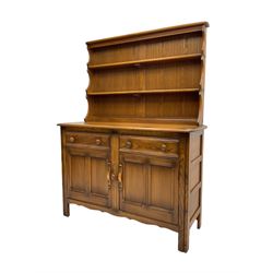 Ercol - 'Golden Dawn' kitchen dresser, two-tier plate rack over base, fitted with two drawers over two panelled cupboard doors
