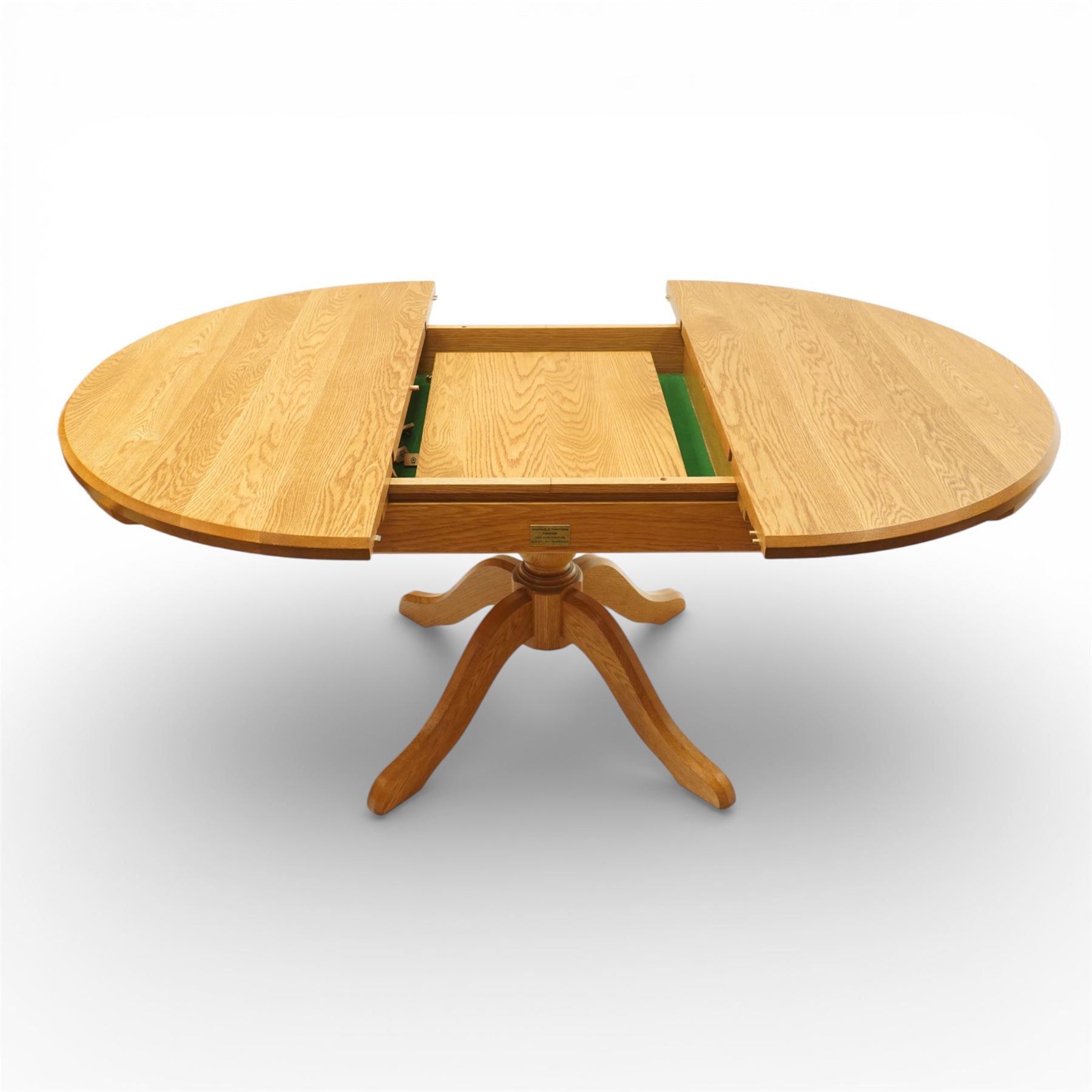 Wharfedale Traditional Furniture - oak dining table and eight ladder back chairs, circular top with stowable leaf forming a large an oval top extending to 167cm, on four splayed legs, together with eight ladder back chairs with green velour drop in seats