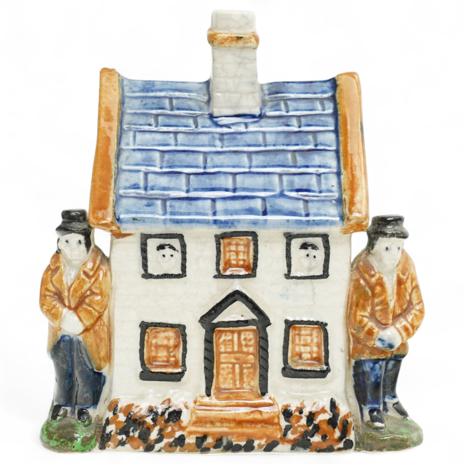 Yorkshire Prattware cottage, circa. 1820, in shades of blue, ochre and white, moulded in relief with two flanking gentlemen figures, H12cm 