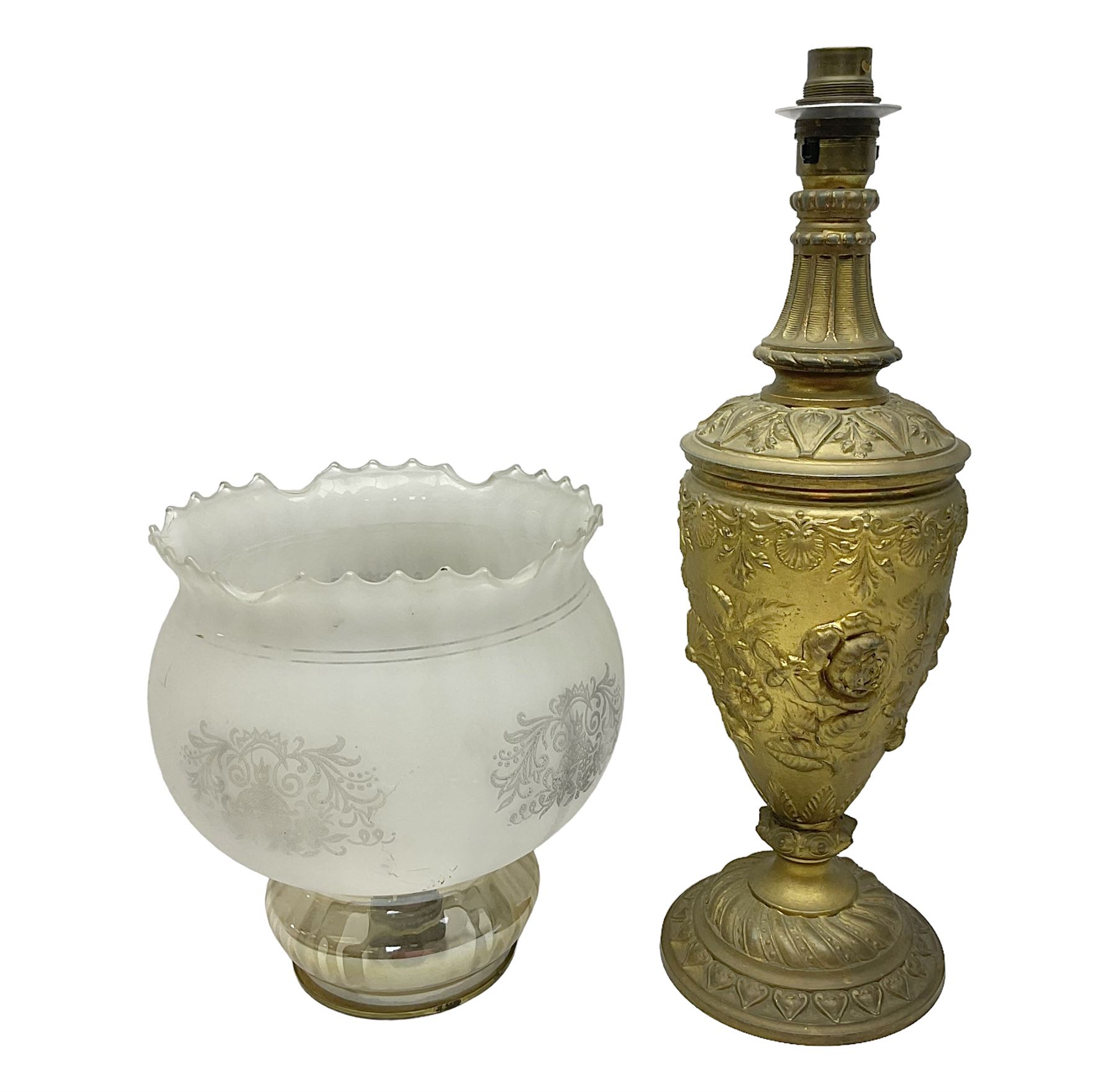 Gilt metal table lamp, heavily embossed with flowers and butterflies, with fluted frosted glass shade, H56cm