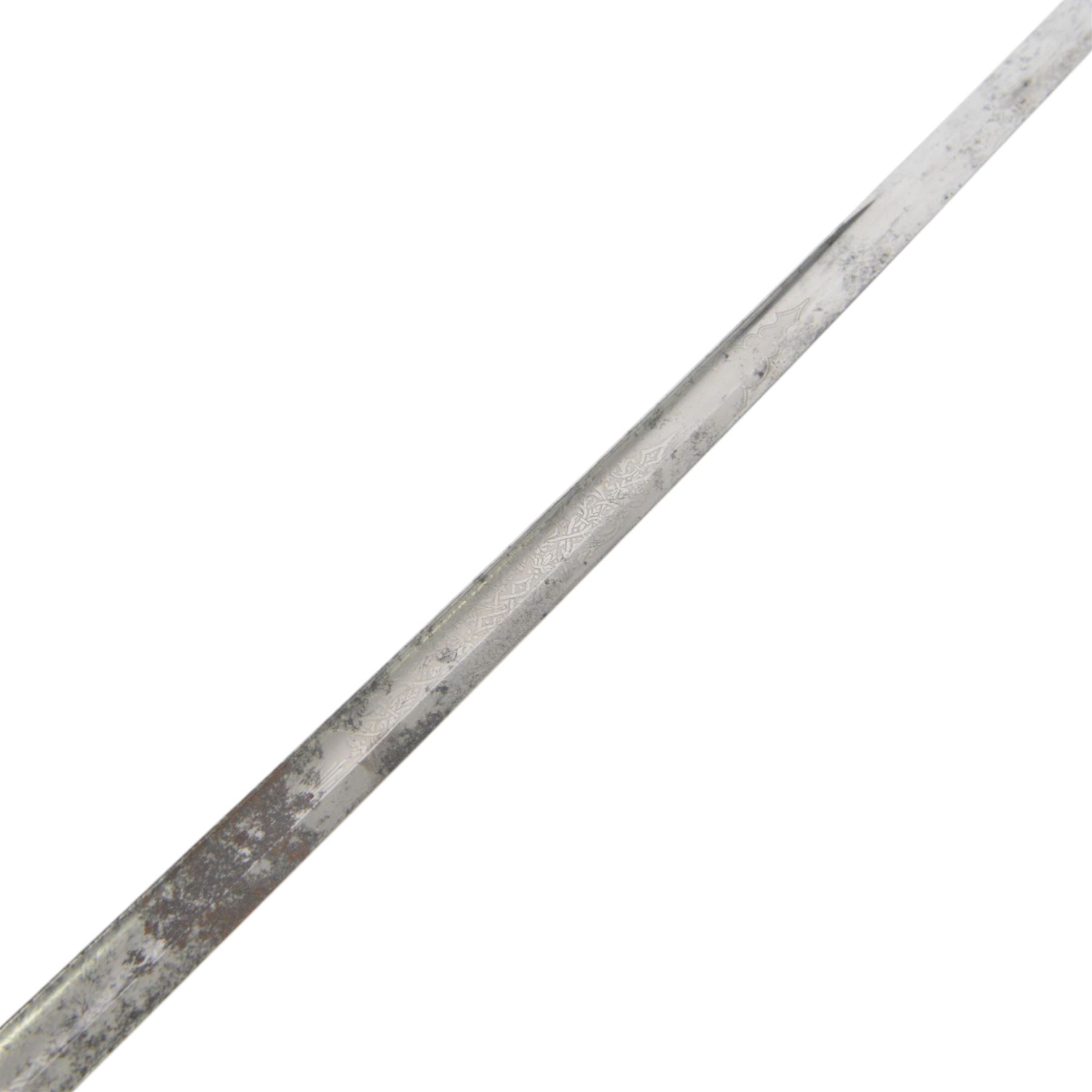 Edward VII 1887 Pattern Heavy Cavalry Officer's sword, 89cm single edge fullered etched blade, numbered 11017 to the back of the blade, decorative pierced guard, fishskin and wire handle, in a leather scabbard, overall L106cm 