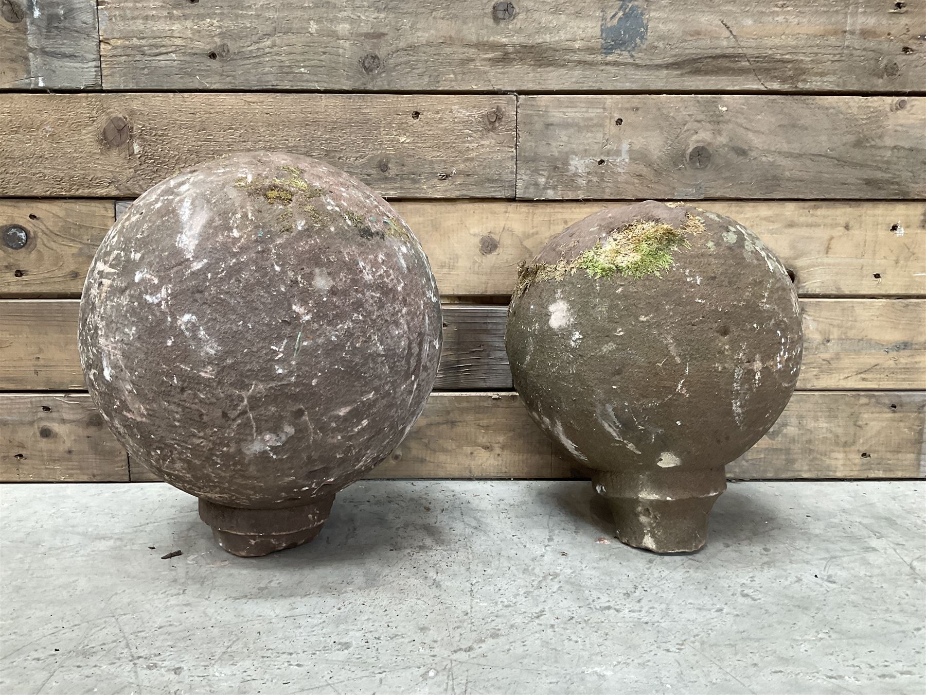 Two spherical stone gate post finials