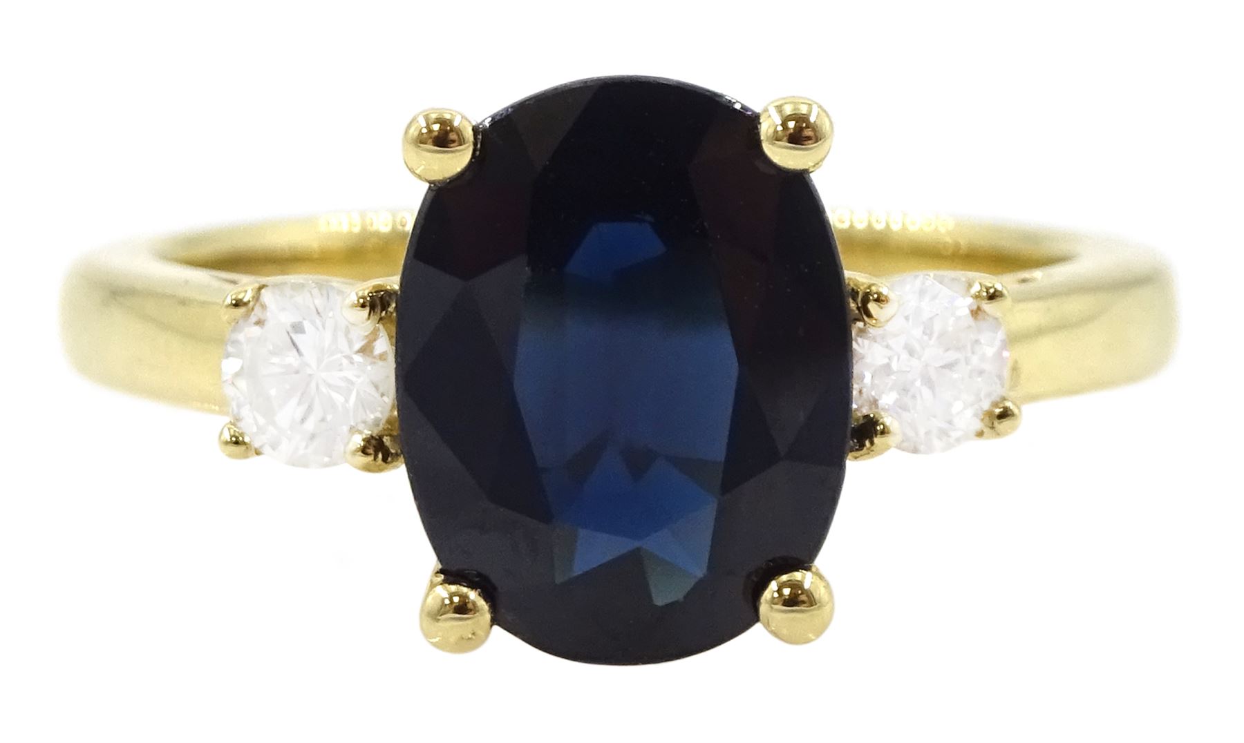 18ct gold sapphire and diamond three stone ring, single oval sapphire of approx 2.20 carat, with a single round brilliant cut diamond set either side, hallmarked, total diamond weight approx 0.25 carat