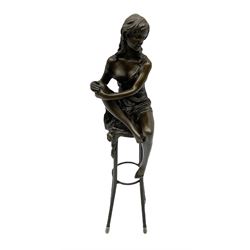 Art Deco style bronze modelled as a female figure, holding her knee, seated upon a chair, after 'Pierre Collinet', H28cm