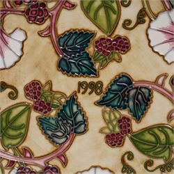 Moorcroft limited edition Birth of Light pattern millennium year plate, numbered 699/2000, impressed and painted marks to base; together with three other year plates comprising 1998, 1992 and Spitalfields Temple Mills edition 1991 plate (4)