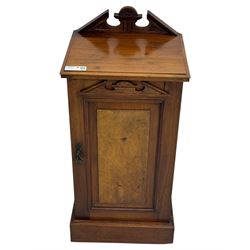 Victorian walnut bedroom suite - wardrobe, dressing chest and bedside cupboard, comprising a full-length wardrobe with broken pediment and central mirrored door, large lower drawer, a matching dressing table with bevelled swing mirror over two trinket drawers and two short drawers over two long drawers, and a single-door bedside cupboard, all with moulded edges, decorative panel work and shaped aprons