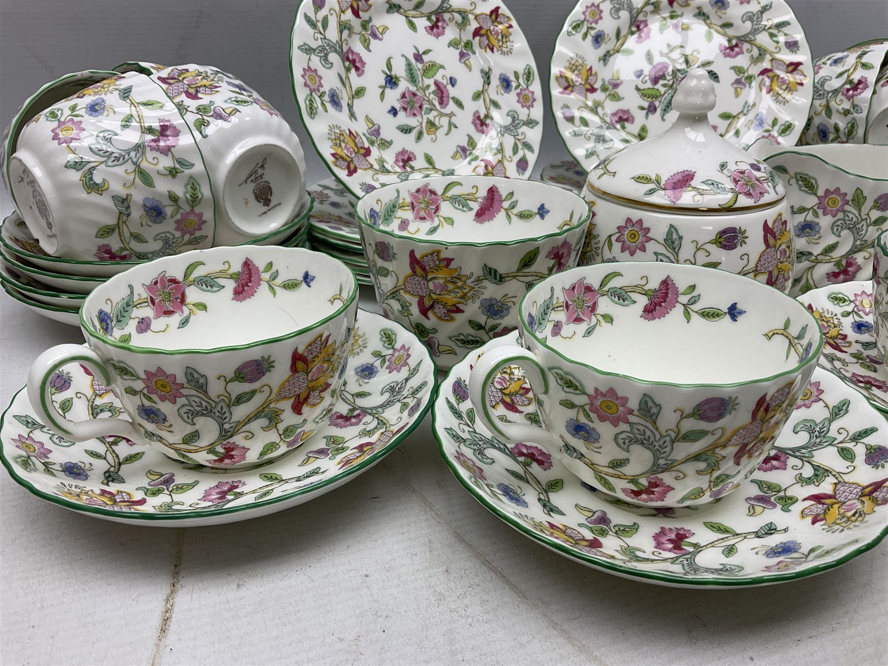 Minton Haddon Hall pattern tea wares comprising twelve teacup trios