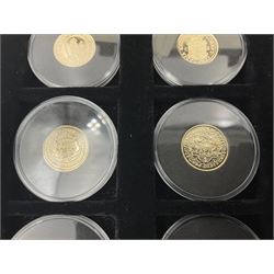 Sixteen hallmarked 9ct gold replica coins from 'The Historic Coins Of Great Britain Museum Gold Collection', housed in a Westminster display case, overall weight approximately 51.3 grams