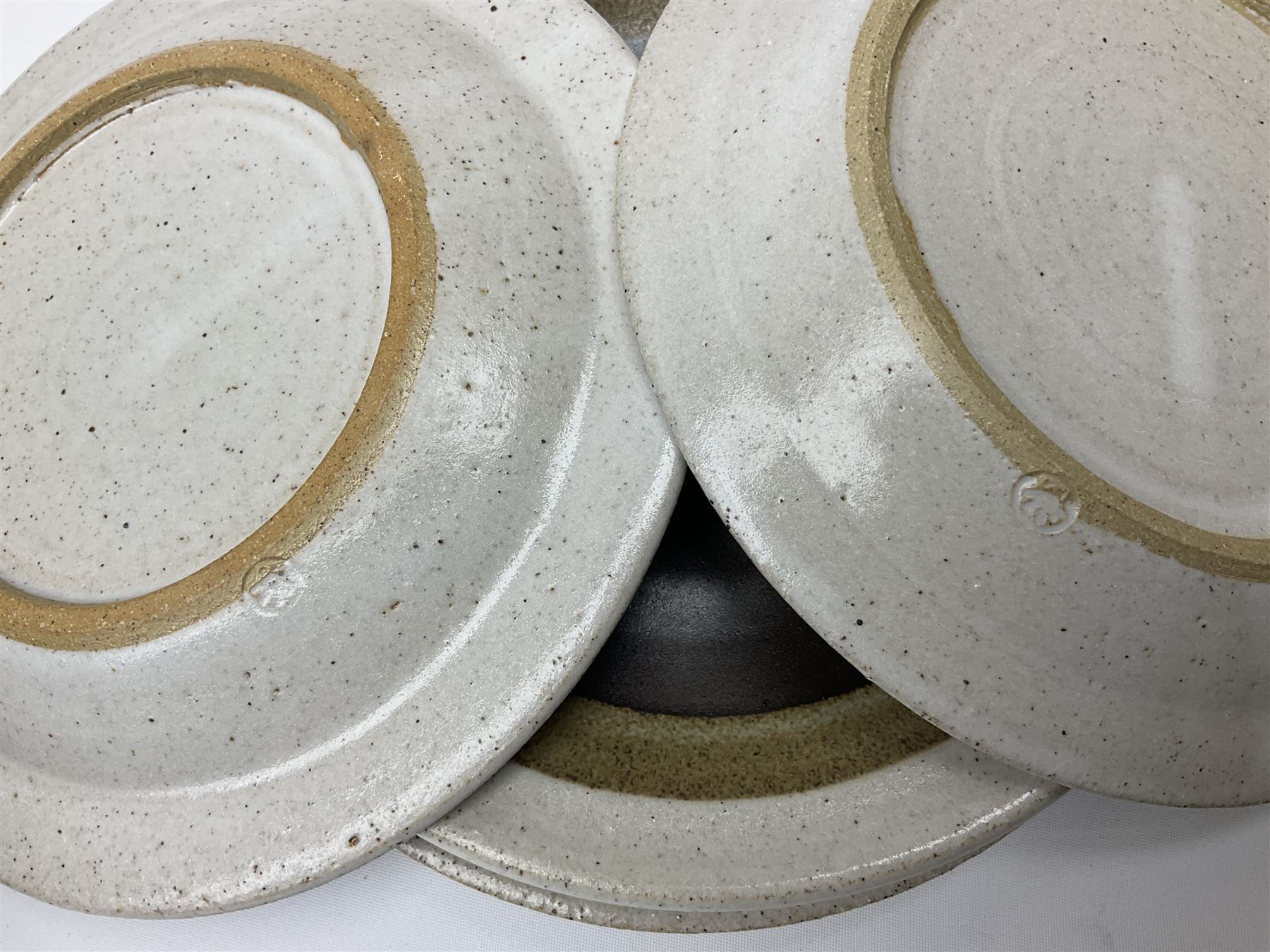 Marianne De Trey (British 1913-2016) stoneware coffee service for twelve, together with a large deep stoneware footed bowl and ladle with wood handle, all decorated in Manganese 'Pattern 1' with impressed shell marks, bowl D27cm