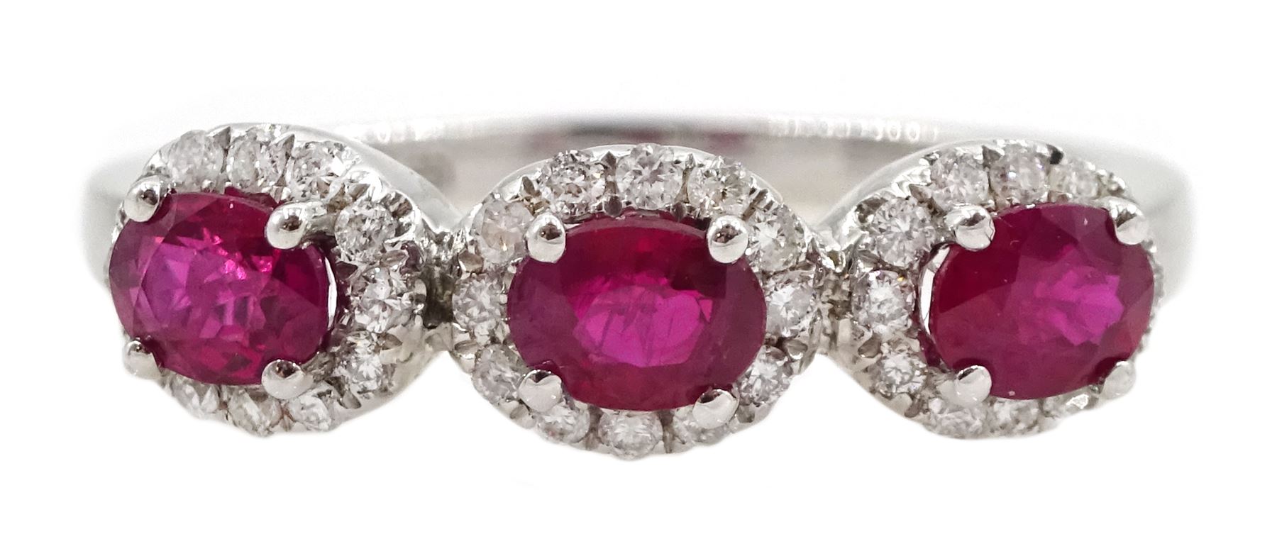 White gold three stone oval ruby and round brilliant cut diamond cluster ring, hallmarked