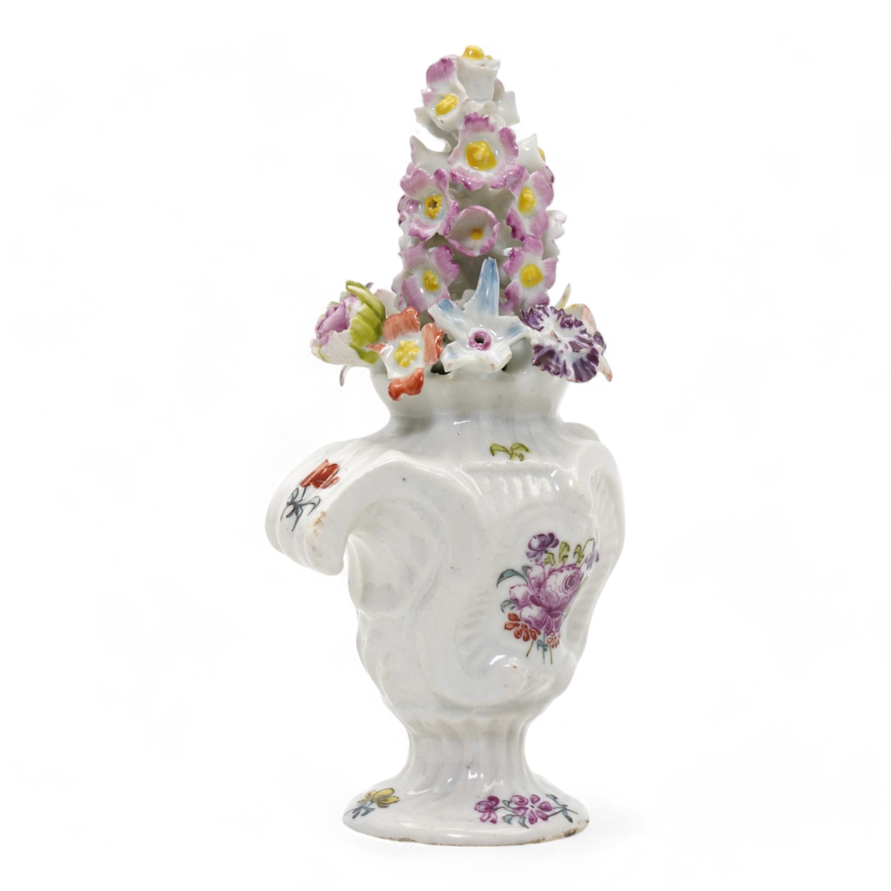 Longton Hall floral table ornament, circa 1755, the moulded rococo base painted with floral sprays and sprigs, below a floral encrusted arrangement, unmarked, H14.5cm 