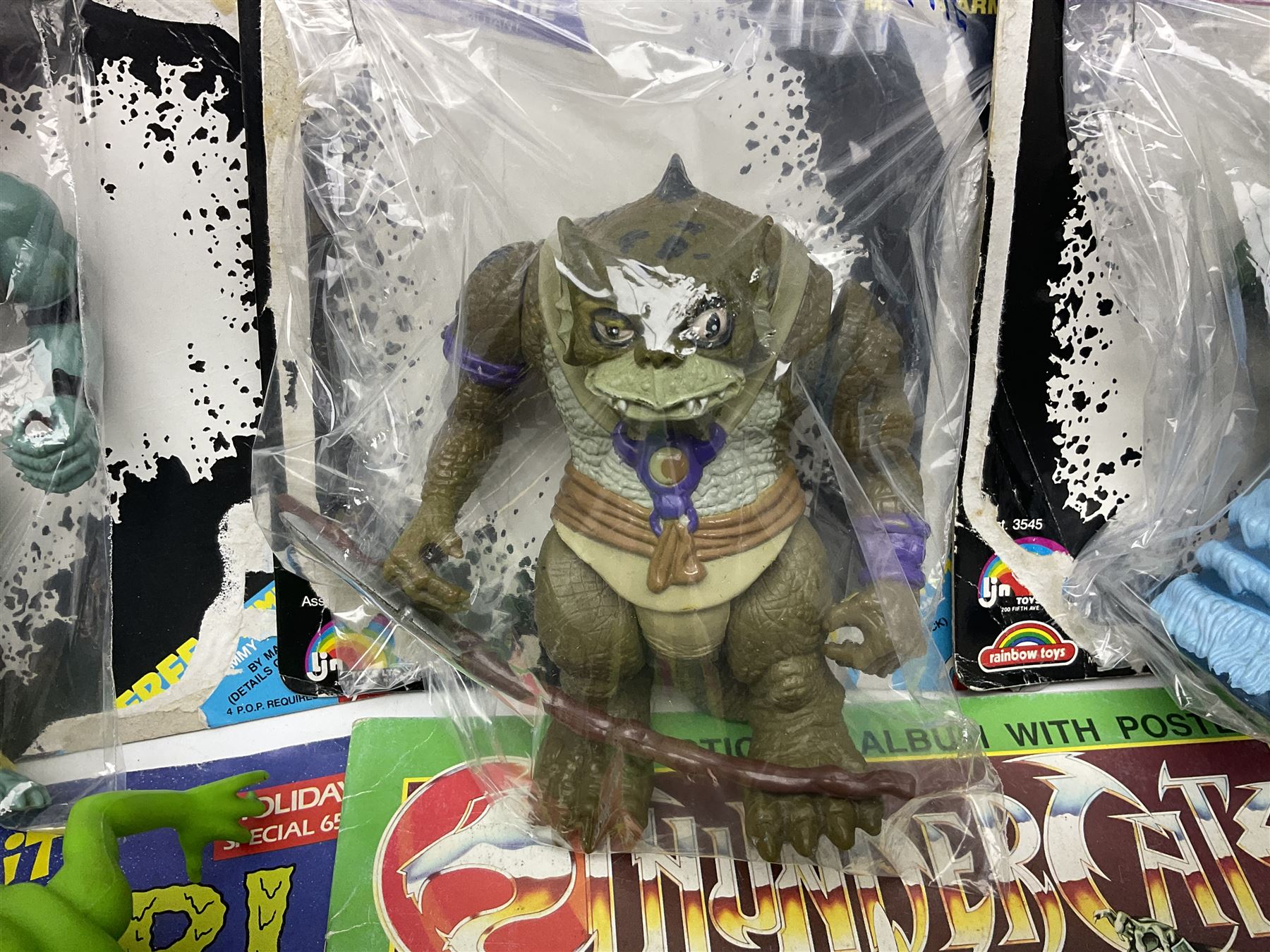 Five 1980s LJN Thundercats figures - Lion-O with sword, Snowman, S-S-Slythe, Tygra and Mumm-Ra; all re-bagged on original backing cards; partially stocked Panini sticker album; story cassette tape and three catalogues; together with Ghostbusters Slimer with food and Comic