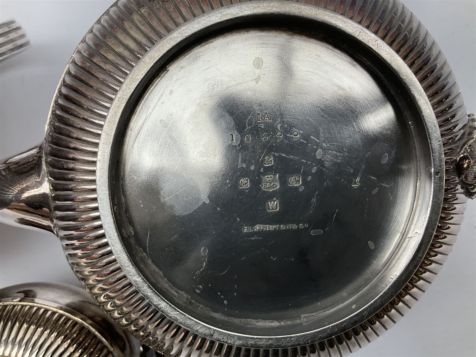 Elkington & Co. silver plate tea set, consisting teapot, coffee pot and milk jug, with engraved foliate decoration and a beaded edge