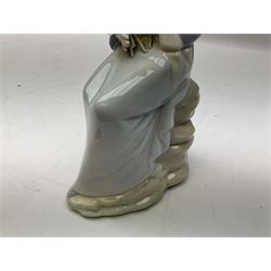 Four Lladro figures, comprising Afternoon Promenade no 7636, Nostalgia no 5071, both with original boxes, Girl with Lilies no 4972 and Madonna no 4534, largest example H27cm