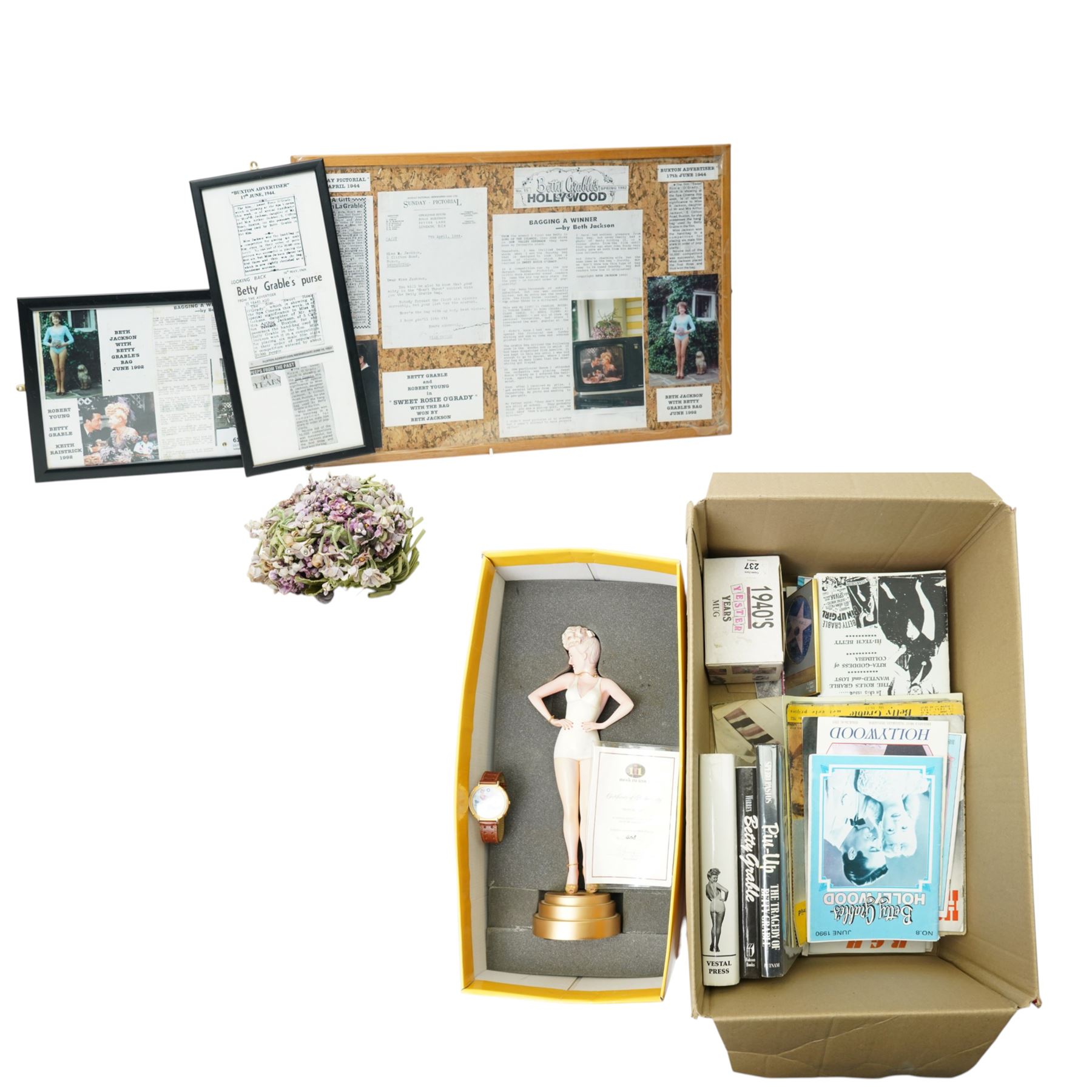 Betty Grable -  A purse designed as a bunch of violets and used by Betty Grable in the film 'Sweet Rosie O'Grady' 1943 and won in a competition in the Sunday Pictorial newspaper by Beth Jackson with newspaper cuttings, letter, photographs etc, together with a limited edition figure of Betty Grable by Modern Icons 458/2500, with magazines, books and other items relating to Betty Gable