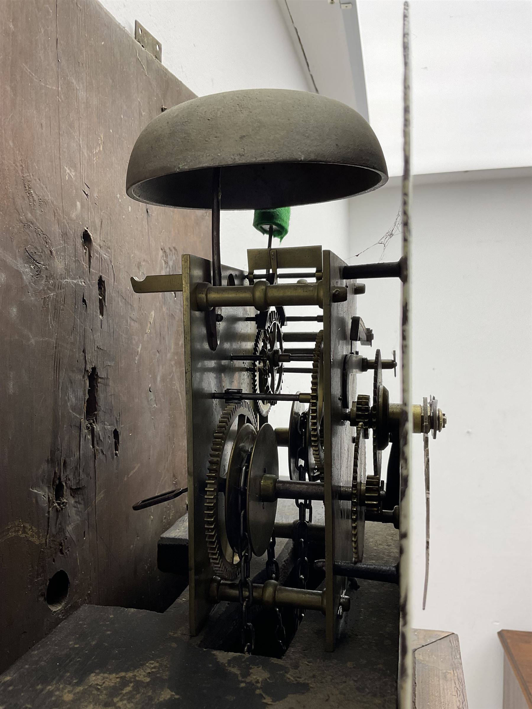 Henry Fisher of Preston (Lancs) -  late 18th century 30-hour oak and mahogany longcase clock c1790, with a flat topped pediment and moulded cornice, square hood door flanked by two plain pillars with brass capitals, trunk with recessed quarter columns, three-quarter length trunk door with an ogee twin spire top and crossbanding, rectangular plinth with canted corners and a narrow applied moulding to the base, circular 13” painted dial with Roman numerals, minute markers and five minute Arabic's, floral decoration to the centre and a semi-circular calendar aperture with date disc behind, original steel serpentine hands, dial inscribed “H Fisher, Preston”, dial pinned directly to a weight driven countwheel striking movement, striking the hours on a cast bell. With pendulum and weight.
Henry Fisher is recorded as working in Preston from 1742-95.
