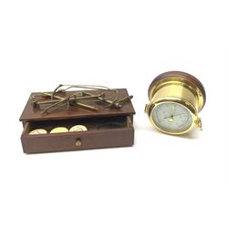 Kundo brass port hole style barometer, D15.5cm together with a set of 19th century brass jeweller's balance scales, on mahogany drawer-fitted base (2)