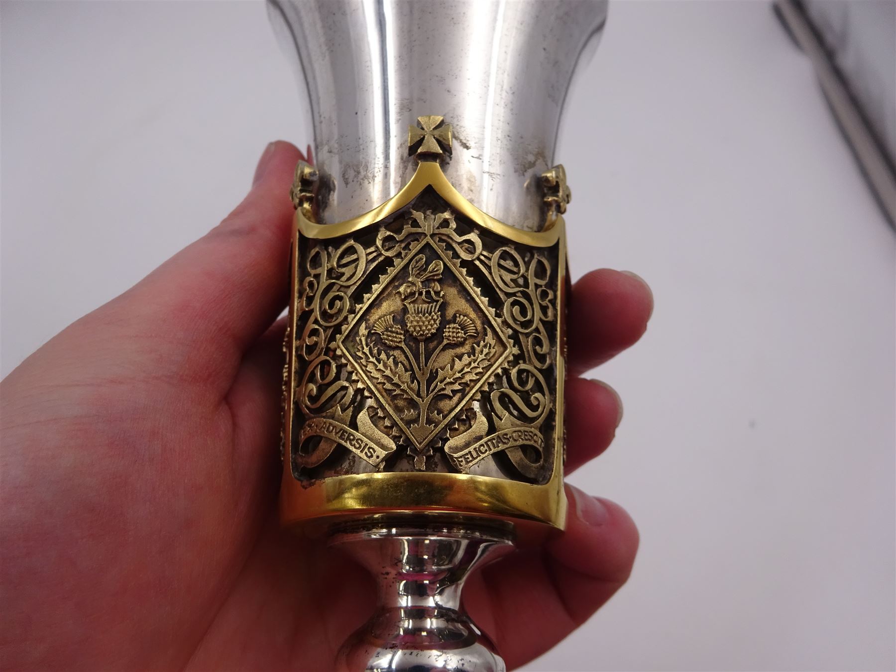 Modern limited edition silver Westminster Abbey Royal Wedding goblet, commemorating the marriage of HRH Prince Andrew and Miss Sarah Ferguson on the 23rd of July 1986, designed by Hector Miller for Aurum, the tapering cylindrical bowl with gilt interior and parcel gilt pierced band to base depicting the Royal Arms, upon knopped stem and circular stepped foot with floral parcel gilt rim, no. 483/750,  hallmarked Hector Miller, London 1986, H17cm