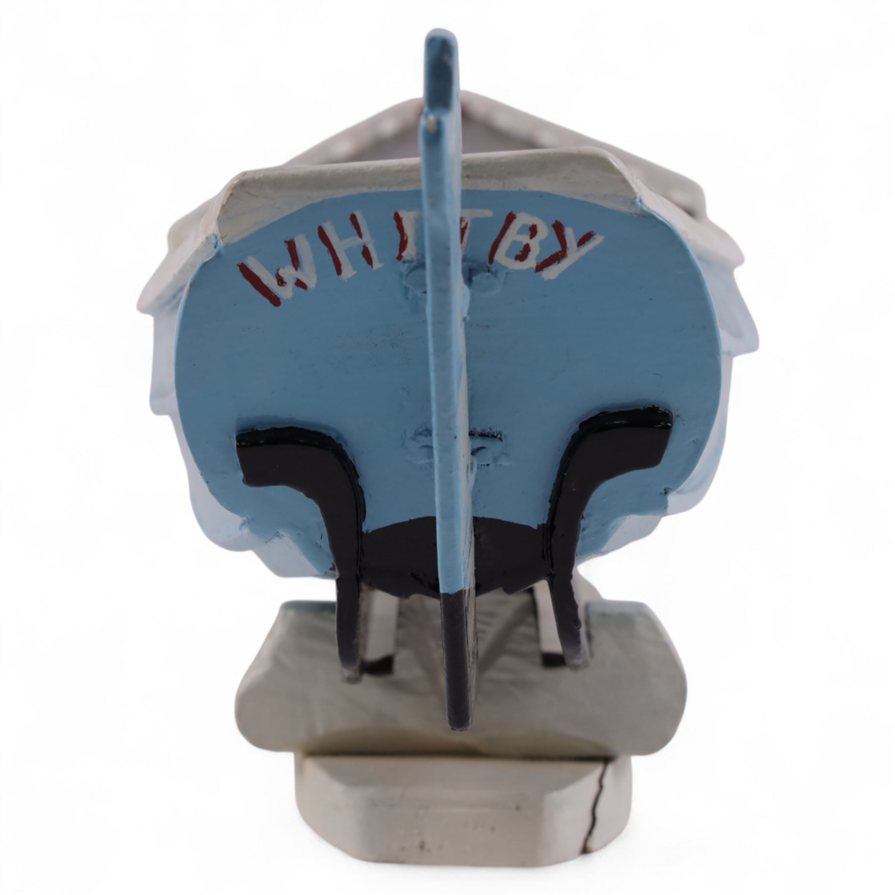 Wooden model of the Whitby fishing coble WY.17 G.Burdon 'Dorothy', painted in blue and white with red detail, with rudder and oars, on a painted wooden stand, L73cm, H20cm