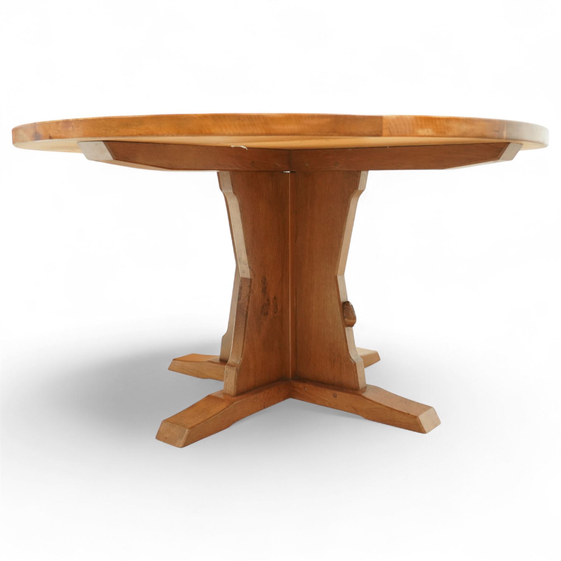 Rabbitman - circular oak dining table, adzed oak octagonal concave dining table, raised on a cruciform base, the supports and sledge feet also adzed, carved with rabbit signature, by Peter Heap of Wetwang