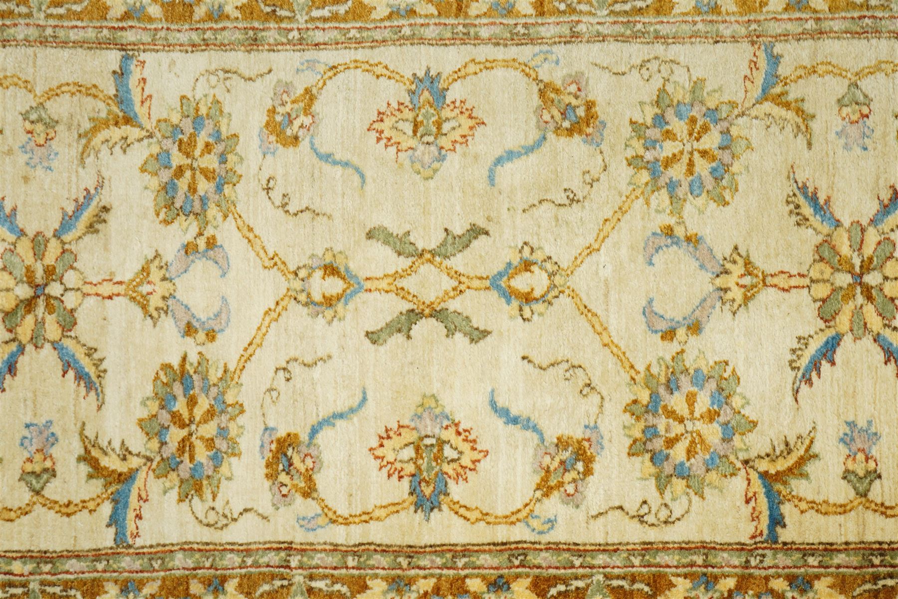 Modern Pakistani Oushak style hand-knotted runner,  ivory field with an all-over scrolling floral vine design incorporating stylized palmettes and rosettes in soft tones of pale blue, sage green and muted gold, enclosed by conforming border, cotton fringe ends 