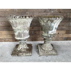 Pair of Regency design weathered cast stone garden urns