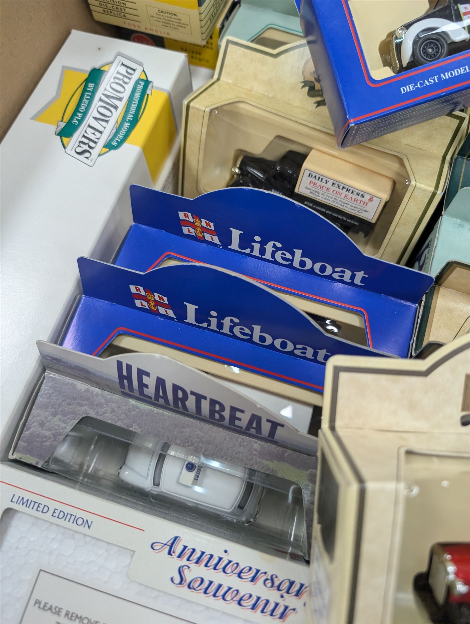 Maisto Jaguar XJ220 model car on stand and a collection of diecast model vehicles, including Vanguards, Unigate and Lledo examples