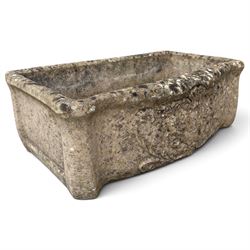 Two weathered composite stone garden trough planters, comprising a low serpentine trough relief moulded with rocaille, shell and foliate ornament (W55cm D32cm H19cm); the plain rectangular trough decorated with four moulded Yorkshire rose medallions to each side (W51cm D26cm H25cm)