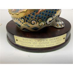 Two Royal Crown Derby paperweights, Dragon of Happiness, limited edition 1227/1500 and Dragon of Good Fortune, limited edition 1227/1500, both with gold stopper, hardwood base, certificate and with printed mark beneath